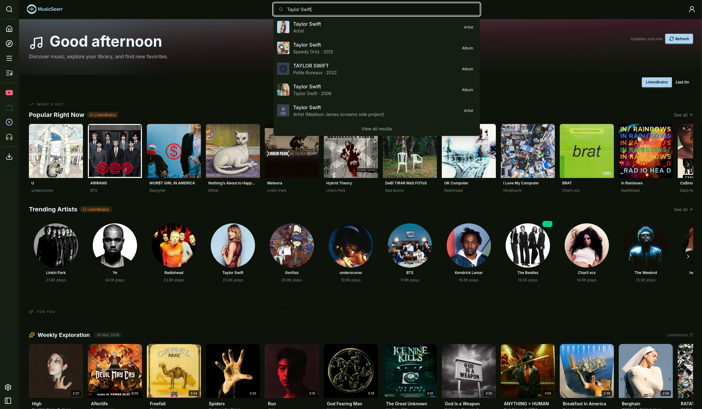 Home page with trending artists, popular albums, and personalized recommendations